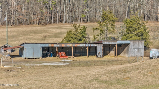 view of pole building with a yard