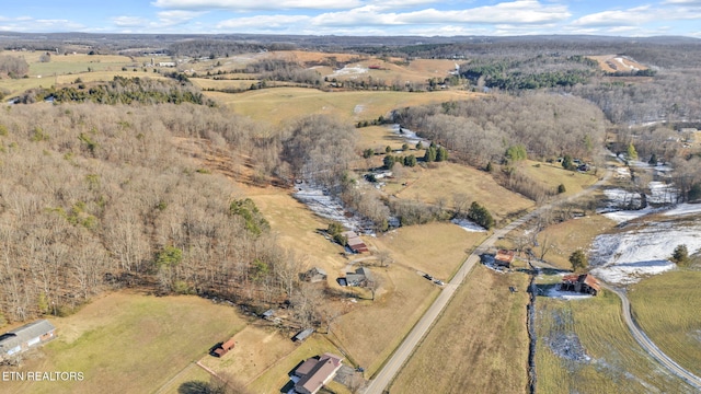 birds eye view of property with a rural view