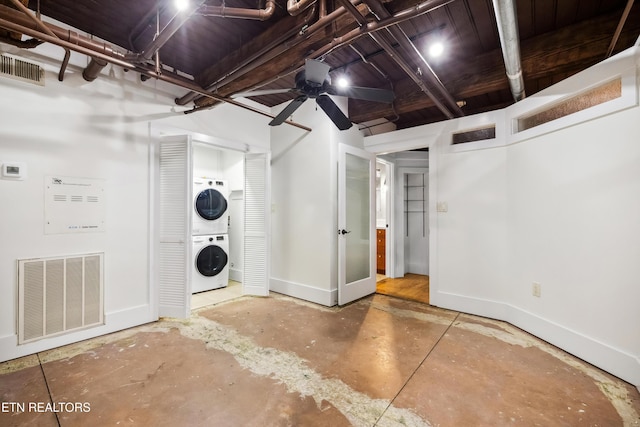 laundry area featuring ceiling fan and stacked washer and clothes dryer