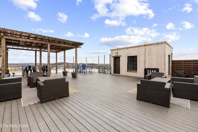 wooden terrace with a pergola and an outdoor hangout area