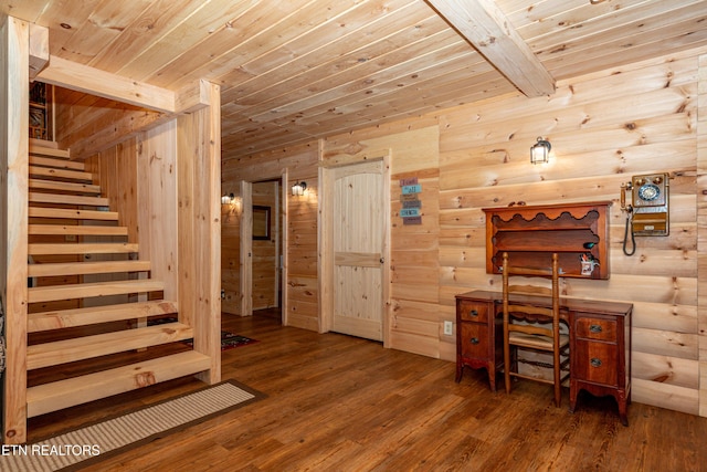 unfurnished office featuring beam ceiling, wood-type flooring, and wooden ceiling