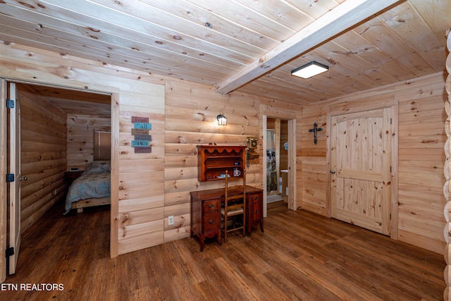 office featuring log walls, beamed ceiling, and wood ceiling