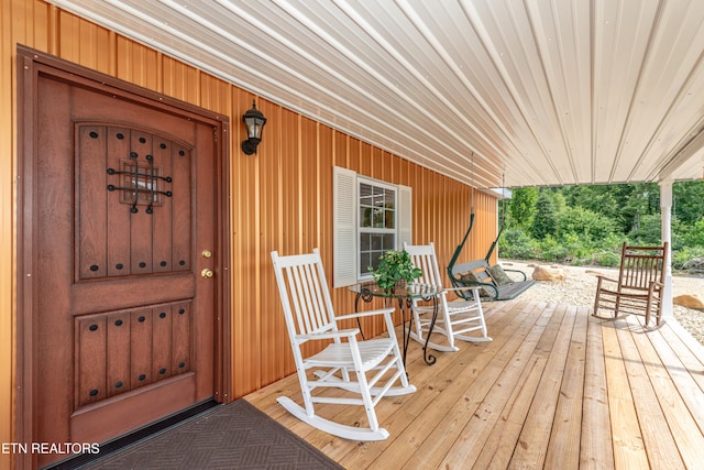 wooden deck featuring covered porch