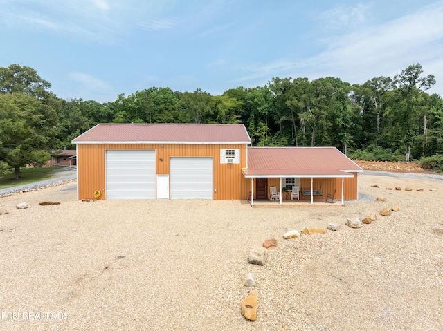 exterior space featuring a garage and covered porch