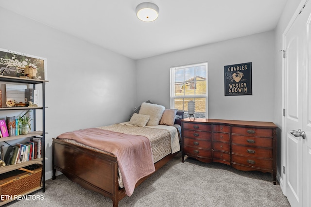 bedroom with light carpet