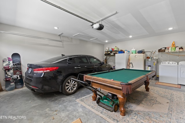 garage featuring separate washer and dryer, water heater, a garage door opener, and white refrigerator