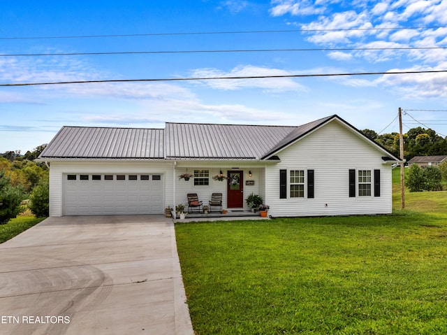 view of front facade featuring a garage and a front lawn