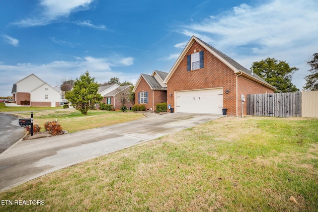 view of front of house featuring a garage and a front lawn