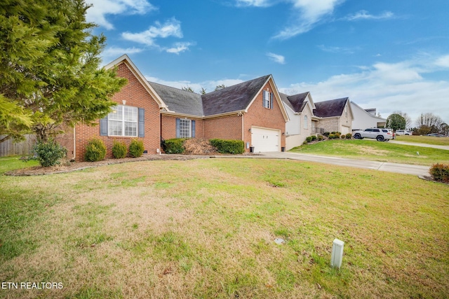 view of front of home with a front lawn and a garage