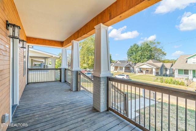 wooden terrace featuring covered porch