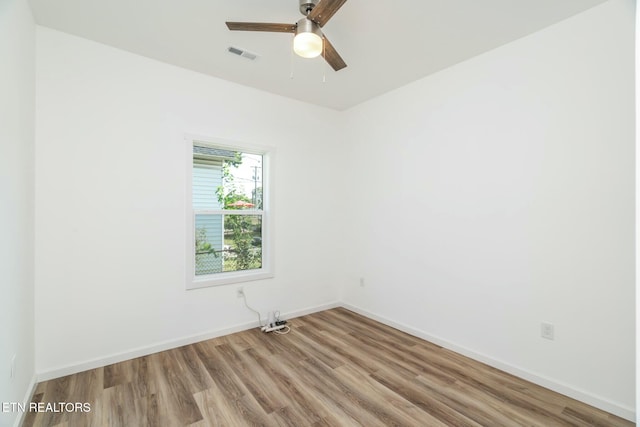 spare room with ceiling fan and light hardwood / wood-style flooring