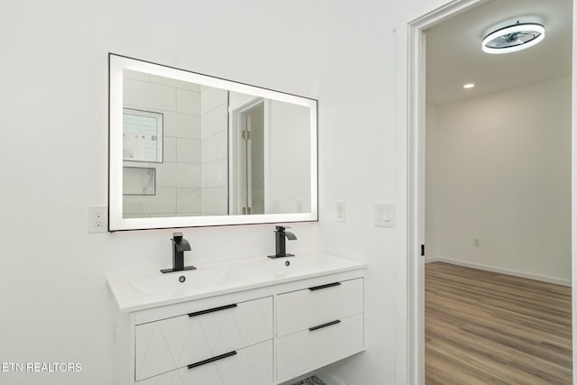 bathroom with hardwood / wood-style floors and vanity