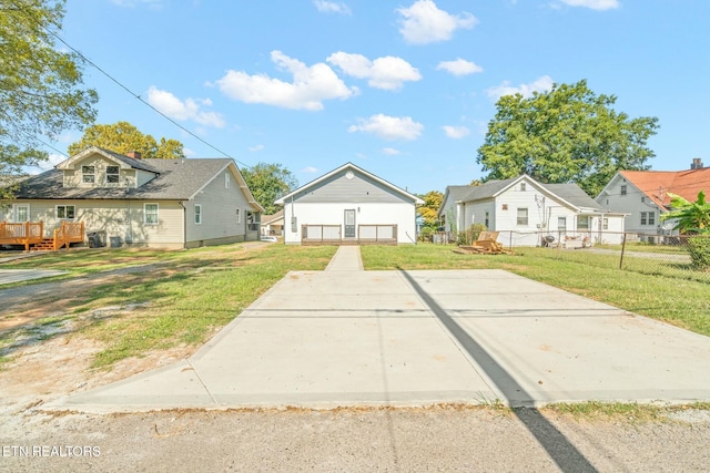 bungalow-style home with a front lawn