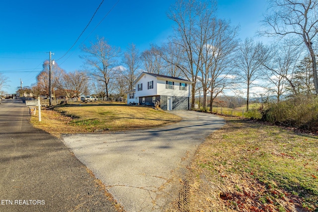 view of property exterior featuring a yard