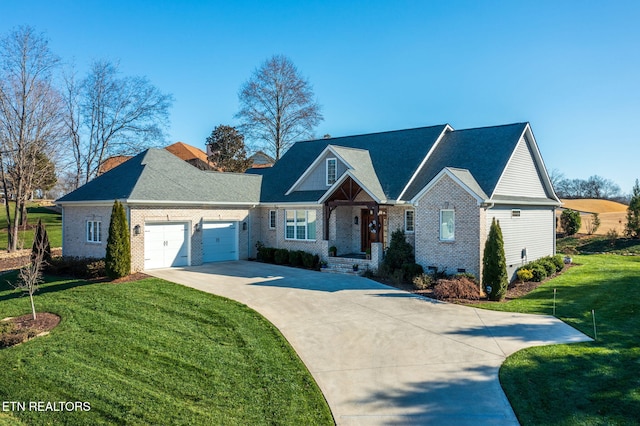 view of front of property featuring a front lawn and a garage