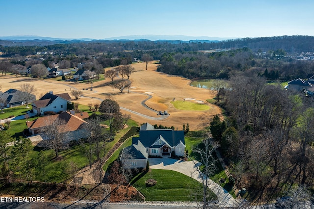 birds eye view of property featuring a water and mountain view