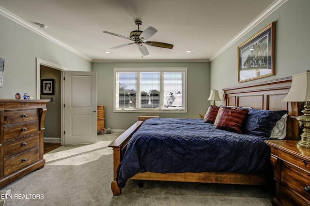 carpeted bedroom featuring ceiling fan and ornamental molding