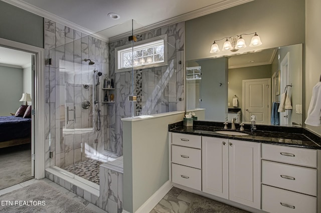 bathroom featuring vanity, a shower with door, and crown molding