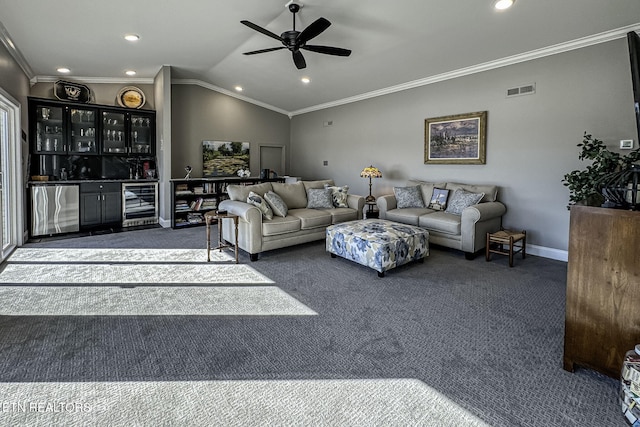 living room featuring beverage cooler, crown molding, ceiling fan, indoor bar, and lofted ceiling