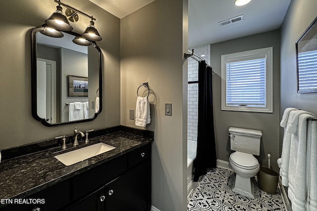 full bathroom featuring tile patterned flooring, vanity, shower / bath combination with curtain, and toilet