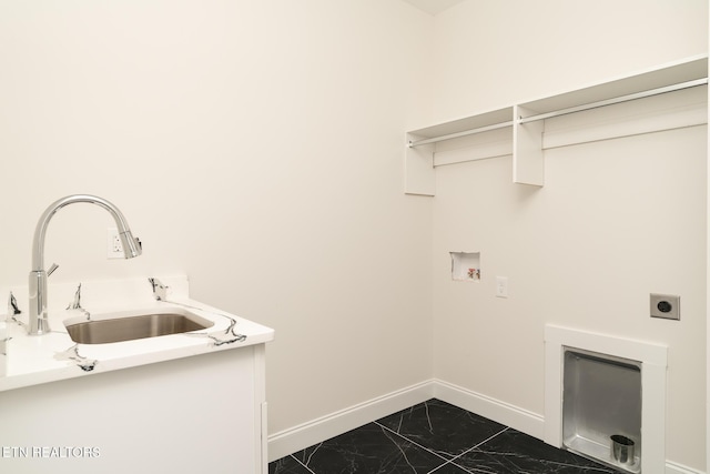 laundry room with hookup for an electric dryer, sink, and hookup for a washing machine