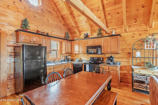 kitchen with wooden ceiling, light hardwood / wood-style floors, wood walls, black appliances, and beam ceiling