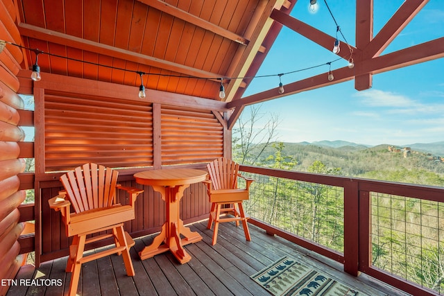 wooden deck featuring a mountain view