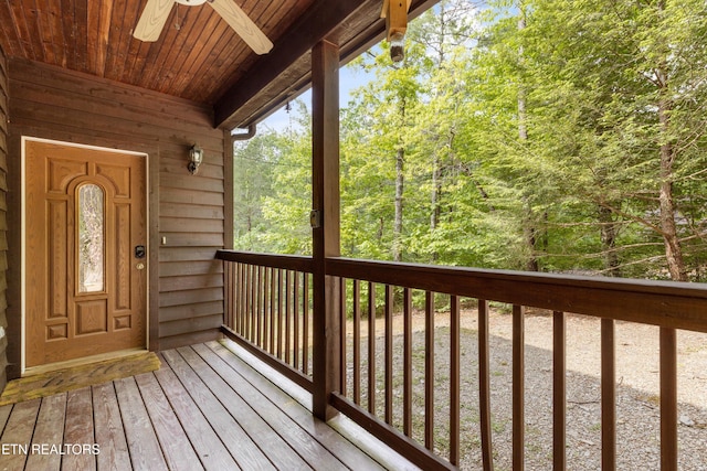 wooden deck featuring ceiling fan