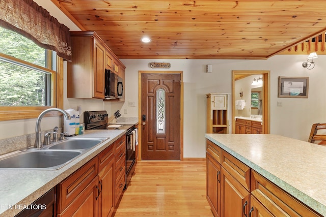 kitchen with sink, light hardwood / wood-style flooring, wooden ceiling, and black appliances