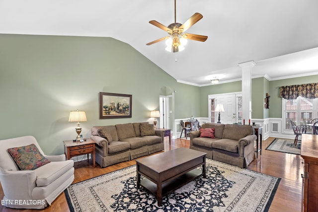 living room with ceiling fan, lofted ceiling, wood-type flooring, and decorative columns