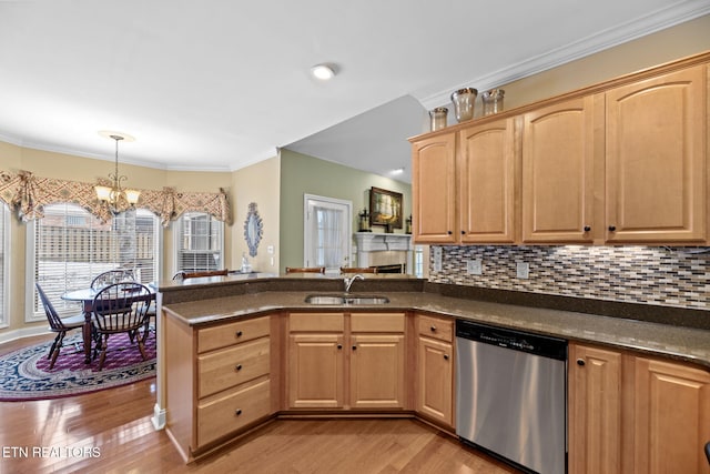 kitchen with light hardwood / wood-style floors, decorative light fixtures, dishwasher, a chandelier, and sink