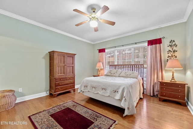 bedroom with ceiling fan, wood-type flooring, and crown molding