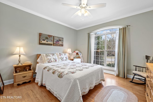 bedroom with ceiling fan, wood-type flooring, multiple windows, and ornamental molding