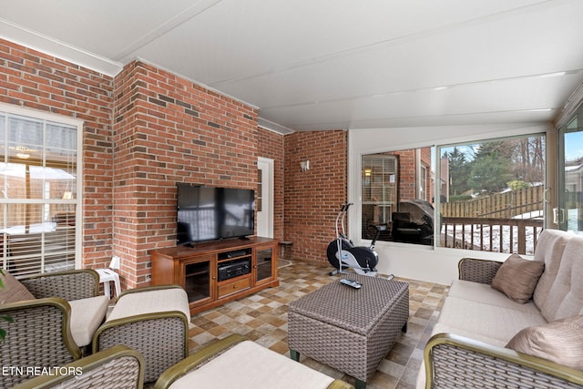 living room with brick wall