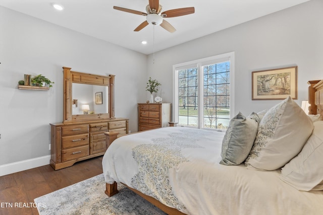 bedroom with ceiling fan and dark hardwood / wood-style flooring