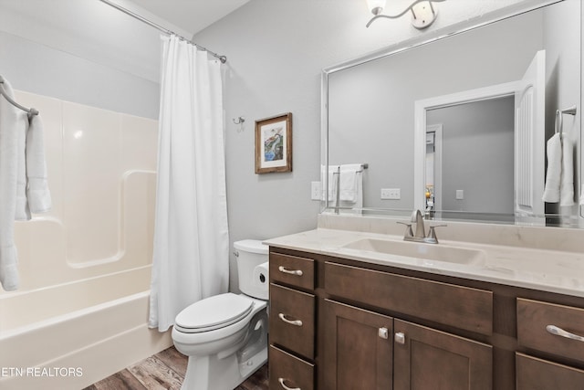 full bathroom featuring toilet, vanity, wood-type flooring, and shower / tub combo