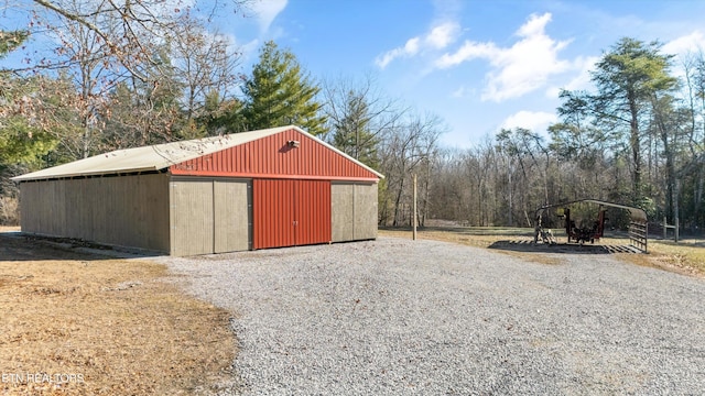 view of outbuilding featuring a carport