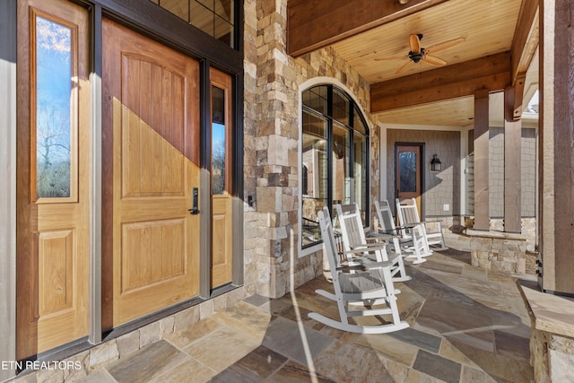 entrance to property featuring ceiling fan