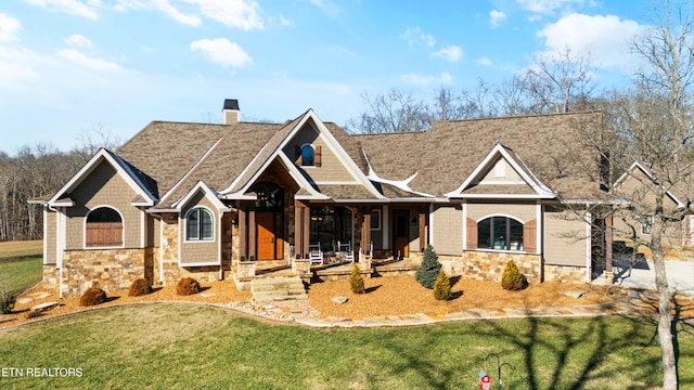 craftsman house with a front lawn