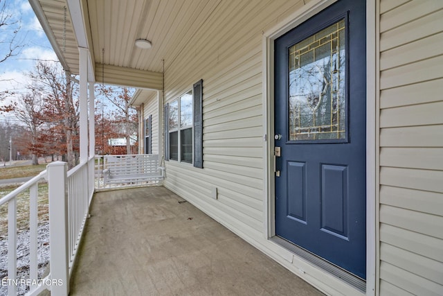 property entrance with covered porch