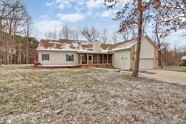 view of front of home with a deck and a sunroom