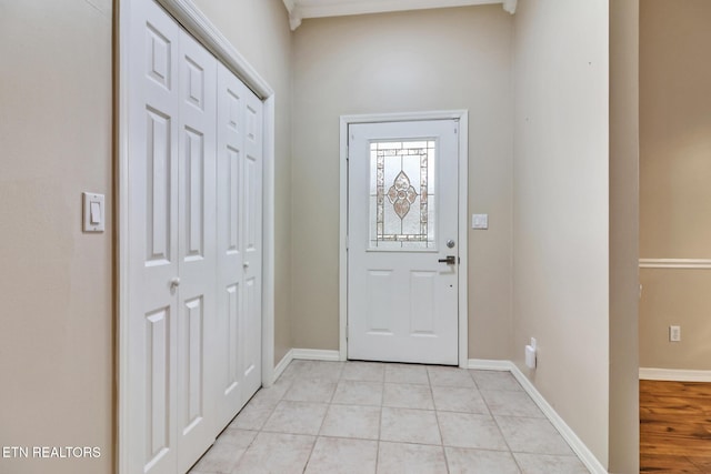 foyer featuring light tile patterned floors