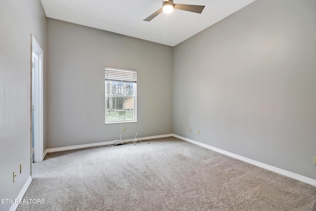 carpeted empty room with ceiling fan