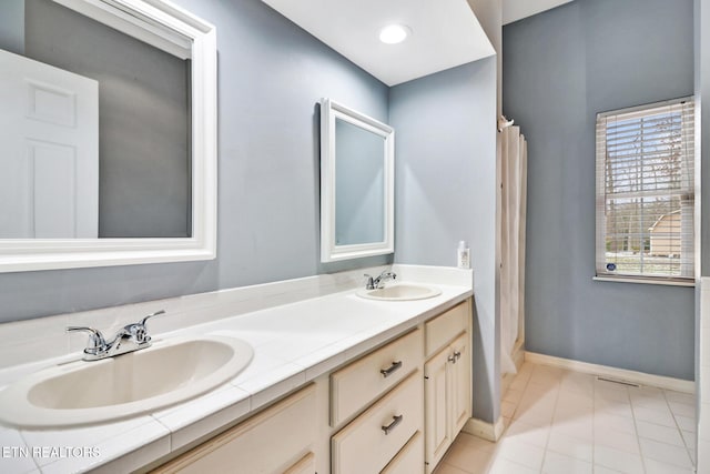 bathroom featuring tile patterned floors and vanity