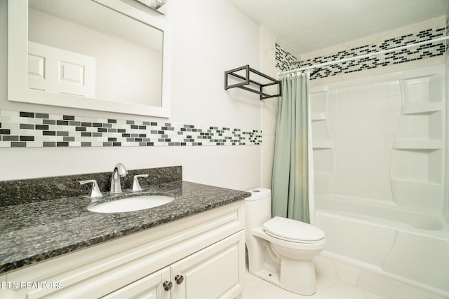 full bathroom featuring toilet, tasteful backsplash, vanity, and shower / bath combo with shower curtain