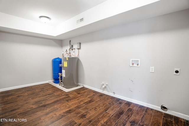 laundry room featuring electric water heater, hookup for a gas dryer, hookup for a washing machine, dark wood-type flooring, and hookup for an electric dryer