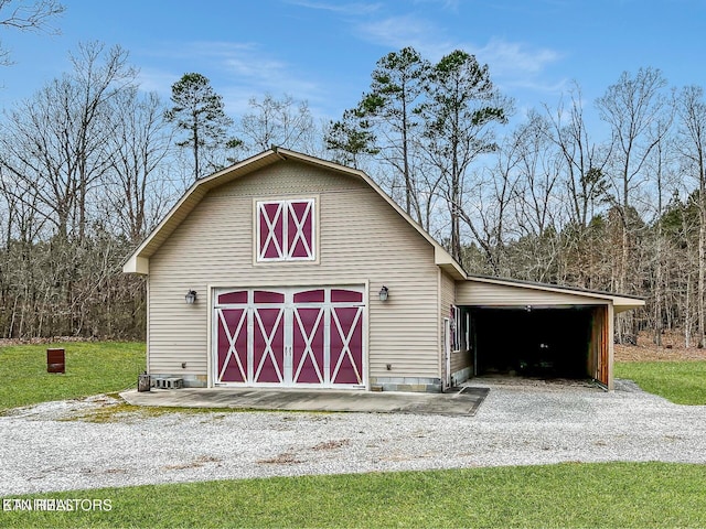 view of outbuilding with a lawn