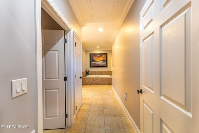 hall featuring recessed lighting, attic access, ornamental molding, light tile patterned flooring, and baseboards