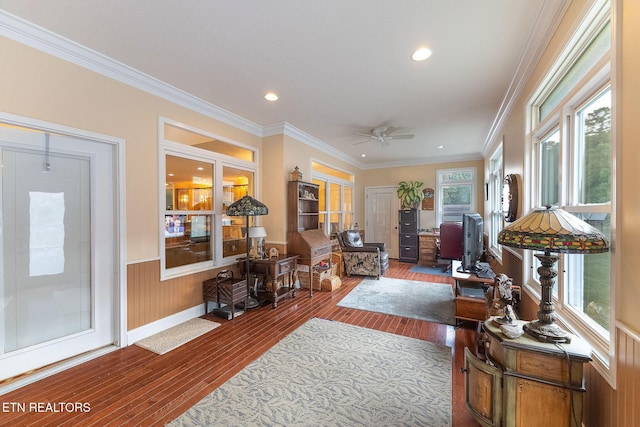 living room featuring ceiling fan, wood-type flooring, and ornamental molding