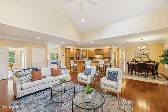 371 Pin Oak Dr, Rockwood, TN 37854 - living area featuring dark wood finished floors, recessed lighting, crown molding, plenty of natural light, and vaulted ceiling